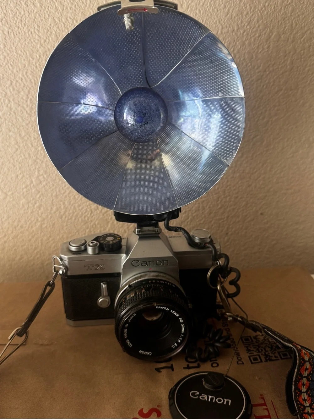 Canon Film Camera with Blue Flash Reflector and Patterned Orange-Accent Strap